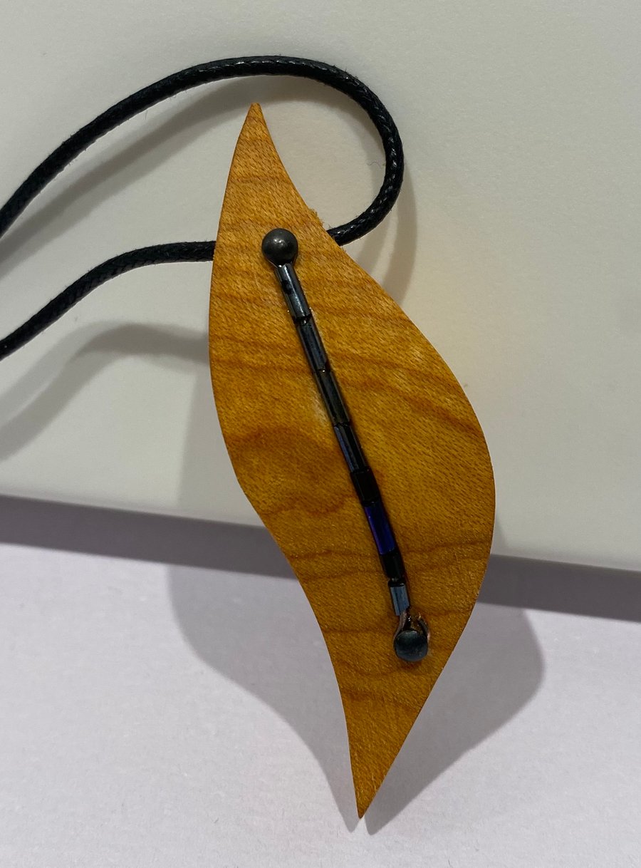 Handmade wooden pendant necklace on leatherette thong