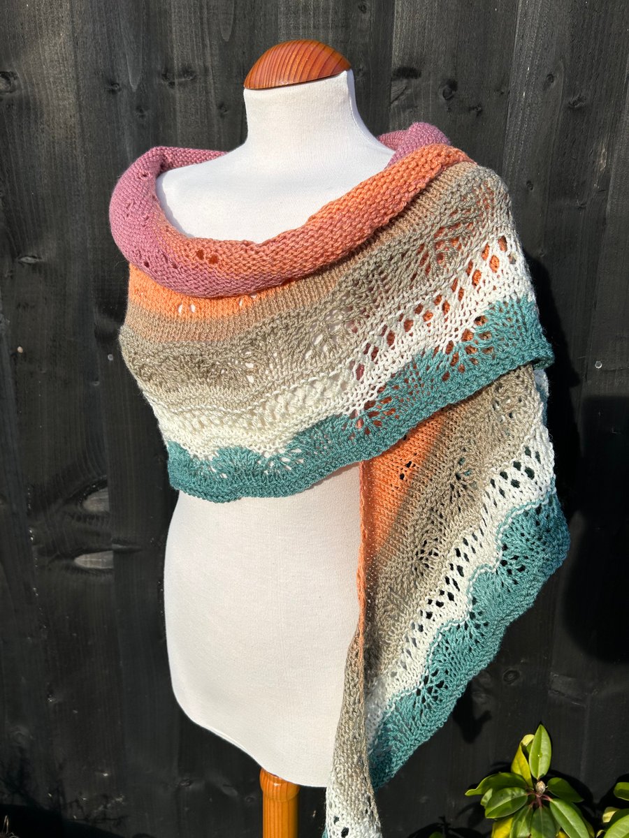 Unique hand knitted extremely shallow crescent wrap scarf in soft wool yarn cake