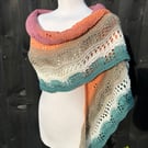 Unique hand knitted extremely shallow crescent wrap scarf in soft wool yarn cake
