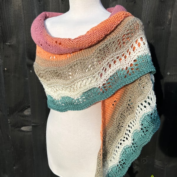 Unique hand knitted extremely shallow crescent wrap scarf in soft wool yarn cake
