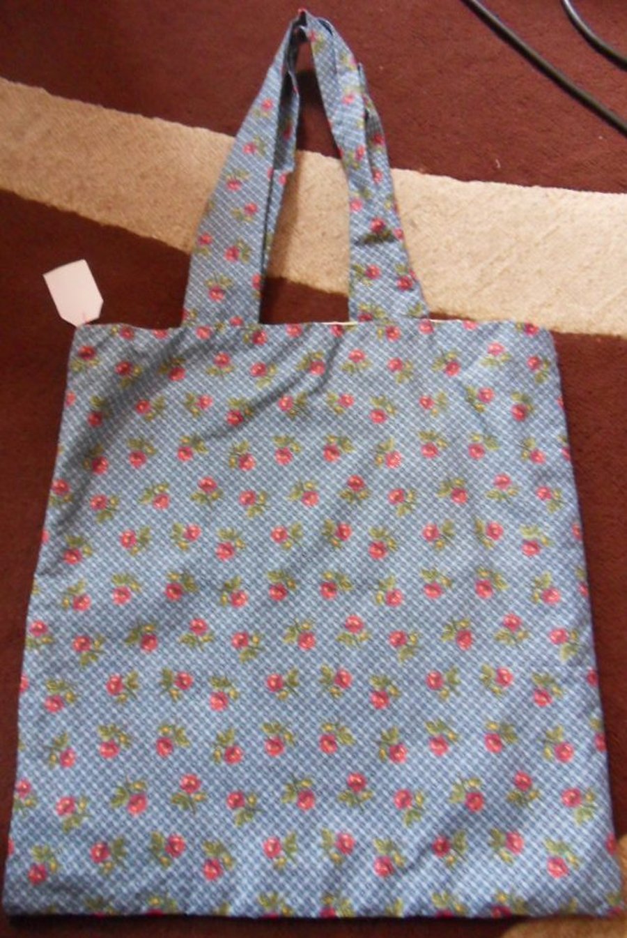 Homemade tote bag.  Red flowers on blue.  Approx measures 13" x 13"
