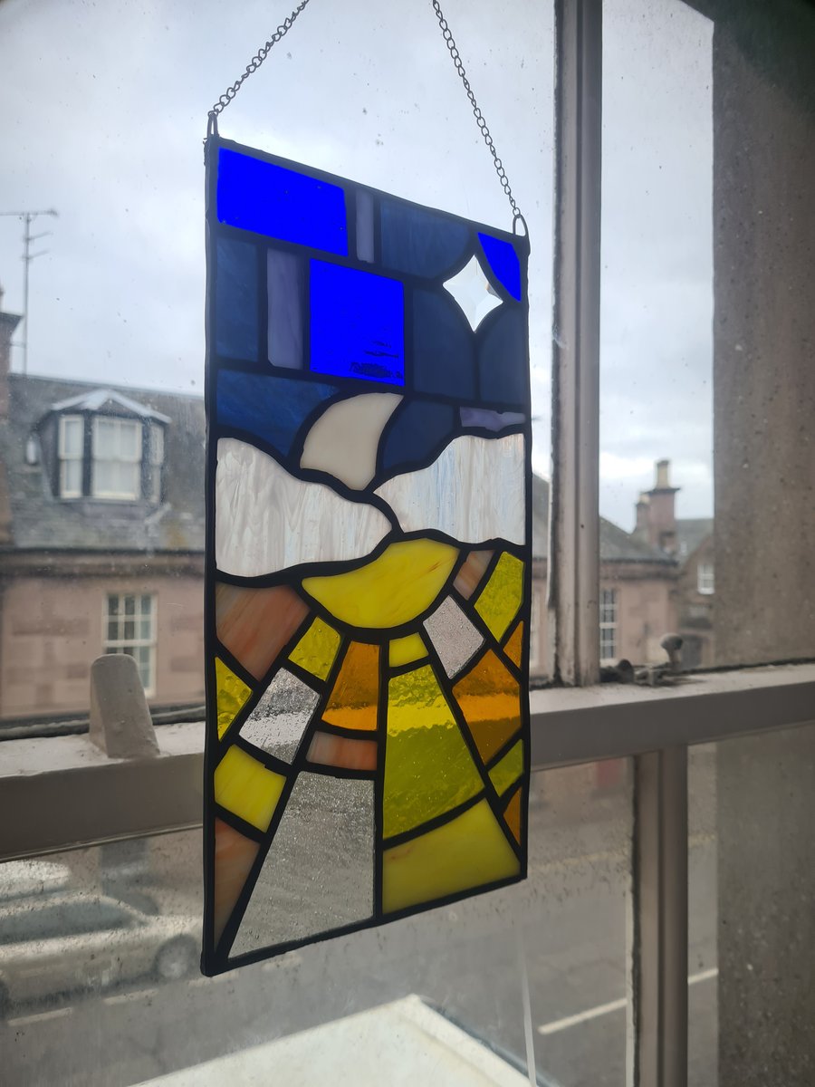 Stained glass sun and moon 