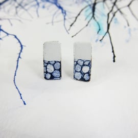 Rectangle white and blue enamel and copper studs with hand drawn detail.