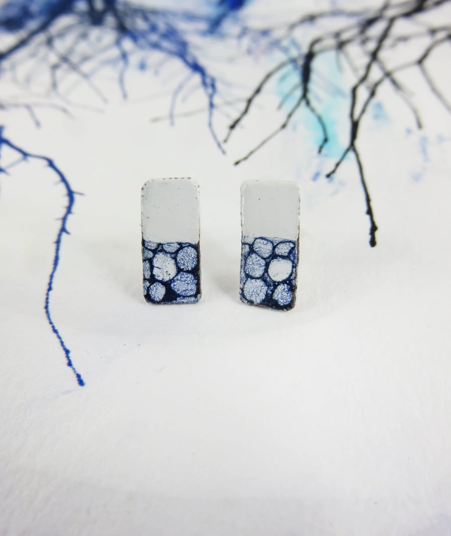 Rectangle white and blue enamel and copper studs with hand drawn detail.