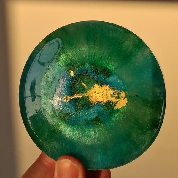 Handmade epoxy resin round coaster or paperweight. Green, blue, gold