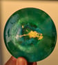 Handmade epoxy resin round coaster or paperweight. Green, blue, gold