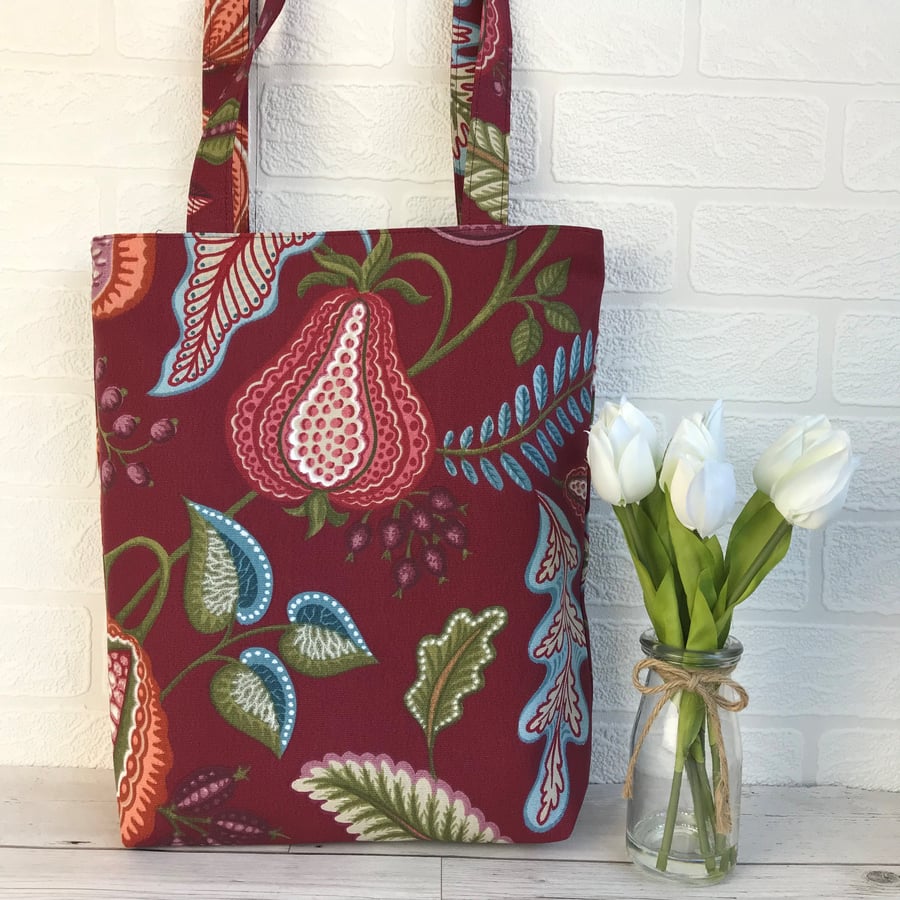 Burgundy tote bag with stylised fruit and foliage print