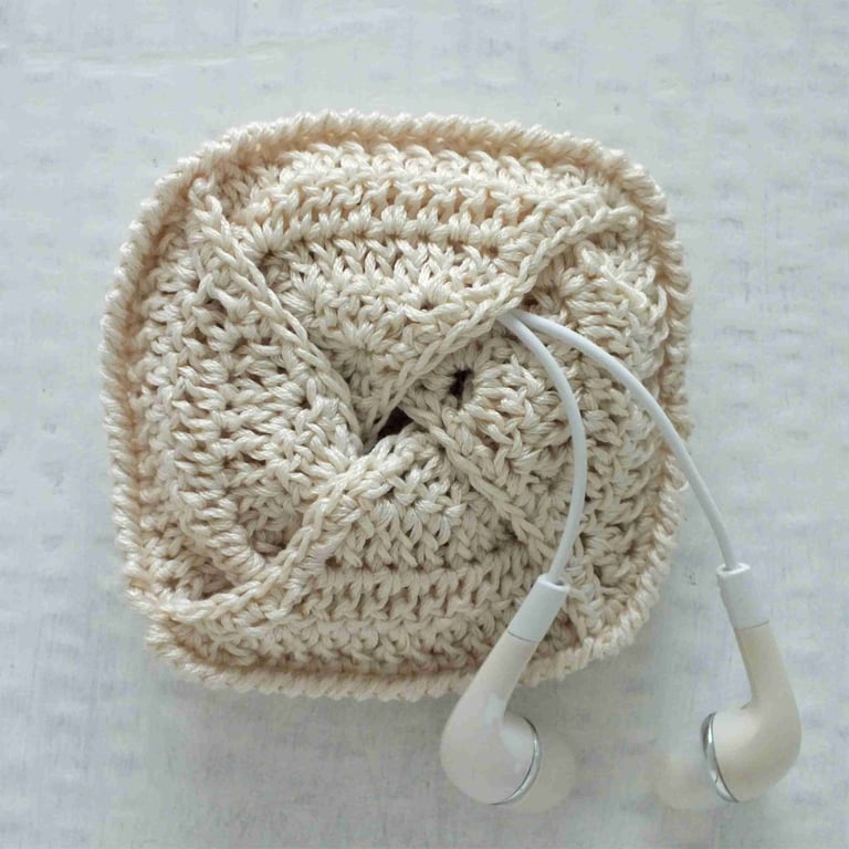 Small crocheted pouch for earbuds or sanitary items