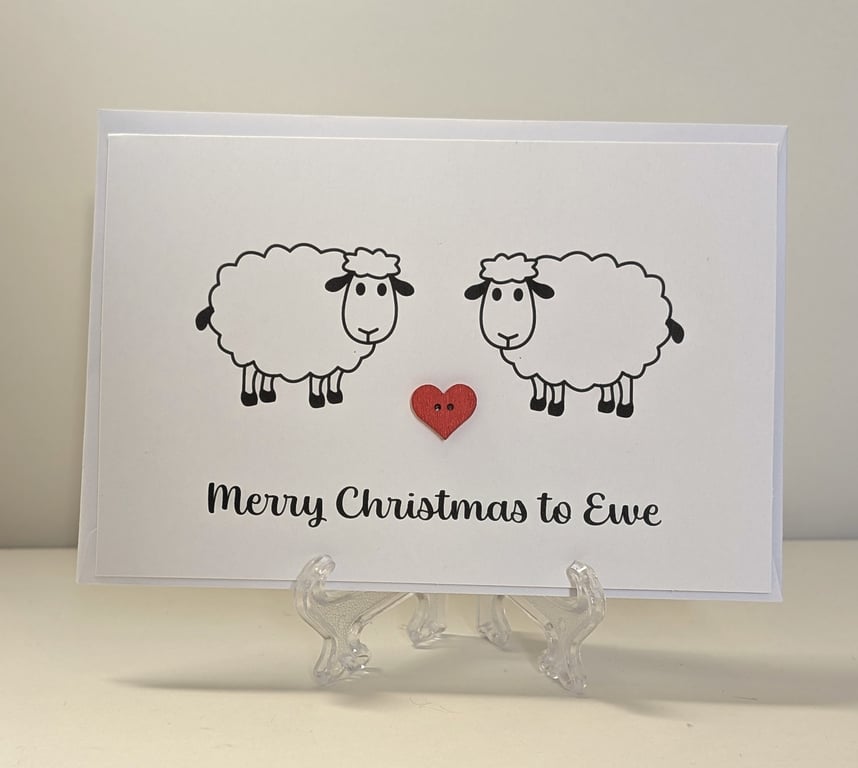 Merry Christmas to Ewe card with a red heart button between two sheep
