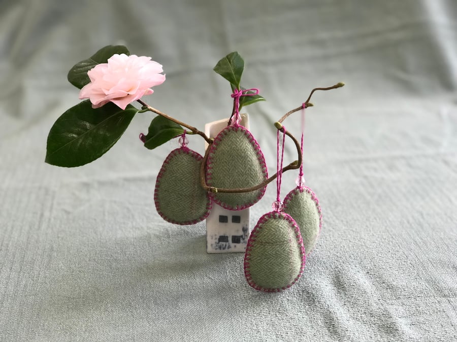 Four Easter egg decorations with glass beads