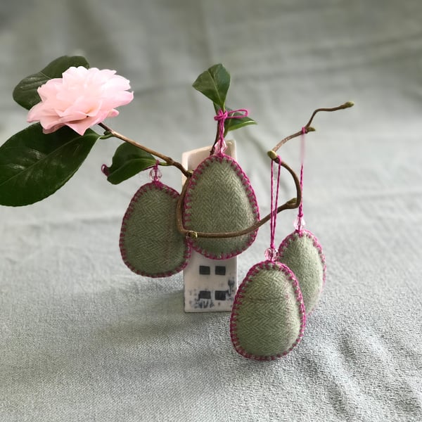 Four Easter egg decorations with glass beads