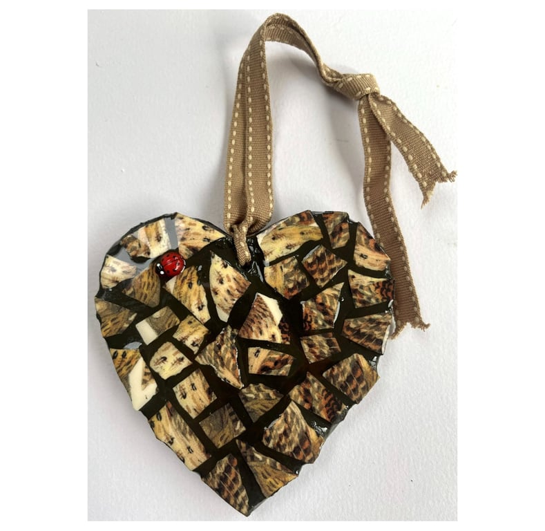 A beautiful heart shaped mosaic pendant with a theme of the colours of a Thrush.