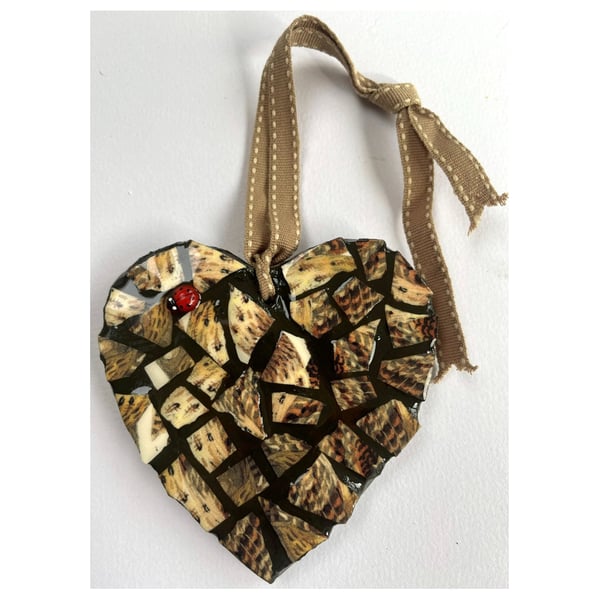A beautiful heart shaped mosaic pendant with a theme of the colours of a Thrush.