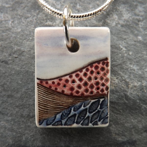 Patchwork Fields ceramic pendant in pink, brown and indigo