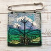 Embroidered wild flower kilt pin brooch.