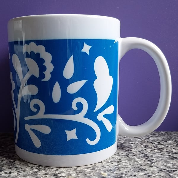 White Ceramic Mug with Blue and White Floral Design