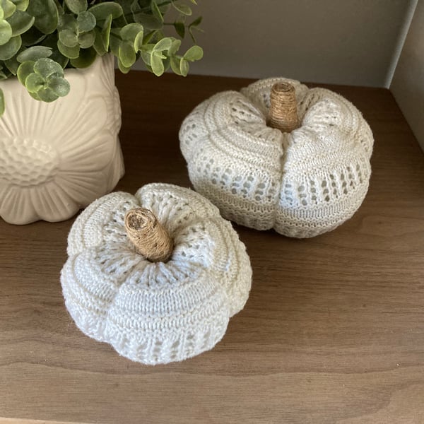 Pair of rustic knit cream pumpkins 