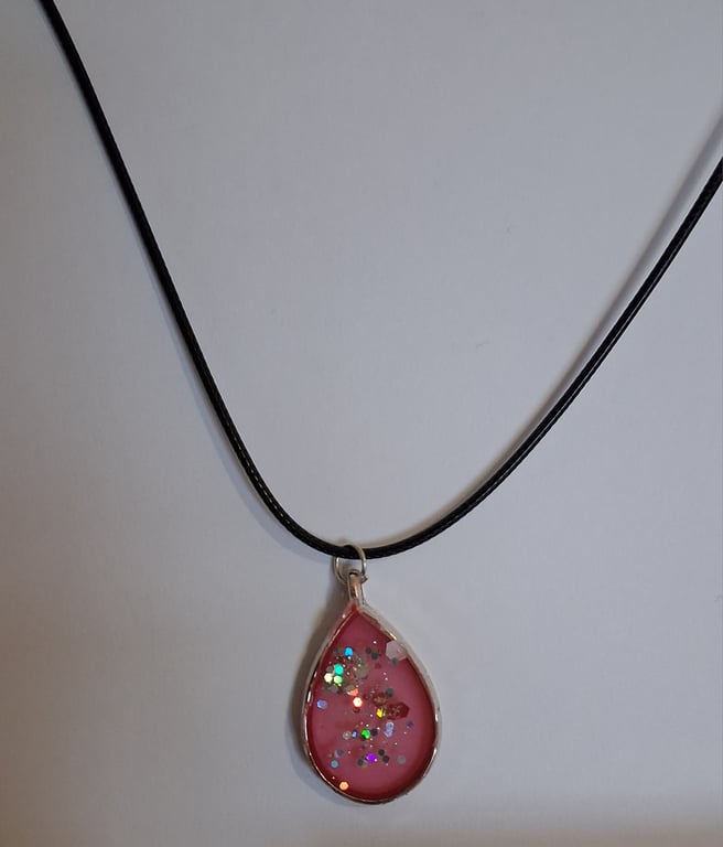 Handmade red and glitter pendant on black waxed cord