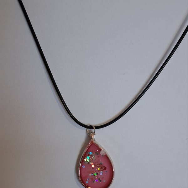 Handmade red and glitter pendant on black waxed cord