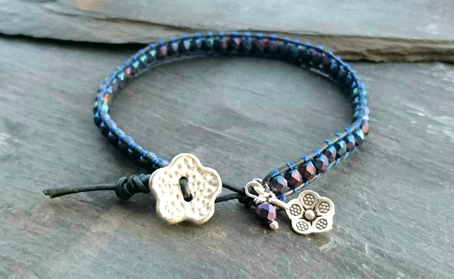 Matte metallic navy blue leather and bead bracelet with flower button