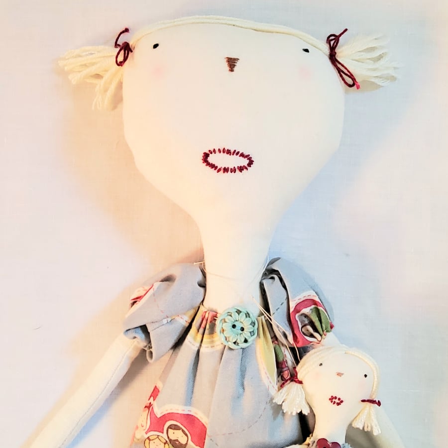 Primitive cloth doll with doll