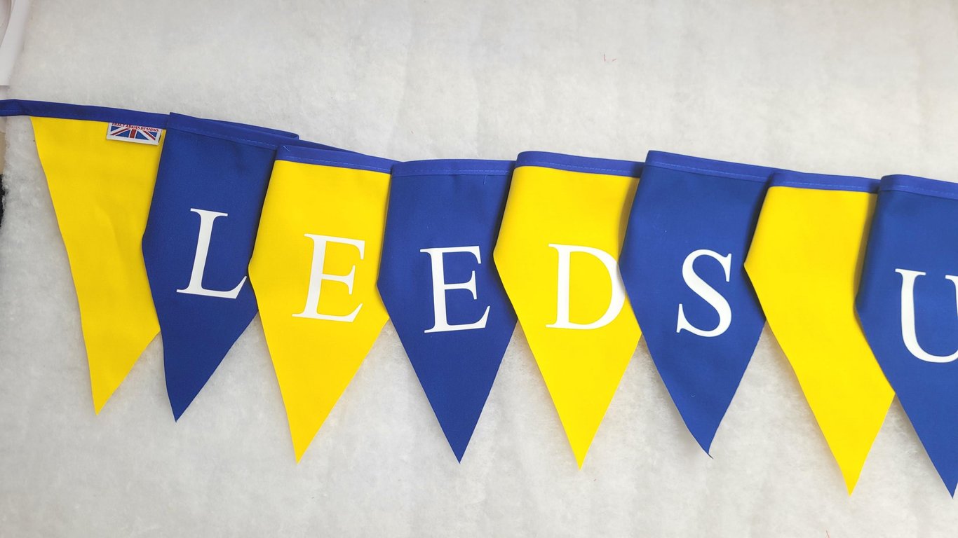 Printed Leeds United bunting - Blue and yellow flags with white lettering