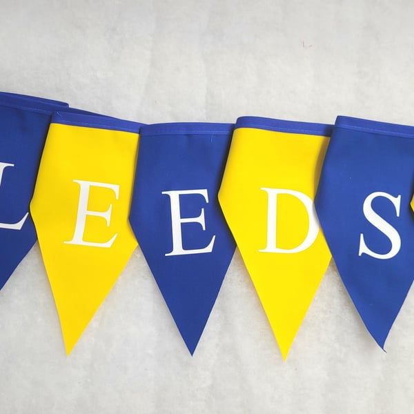 Printed Leeds United bunting - Blue and yellow flags with white lettering