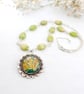 Green Pendant Necklace with Flower Art and Rosary-style Beadwork  - Image 1