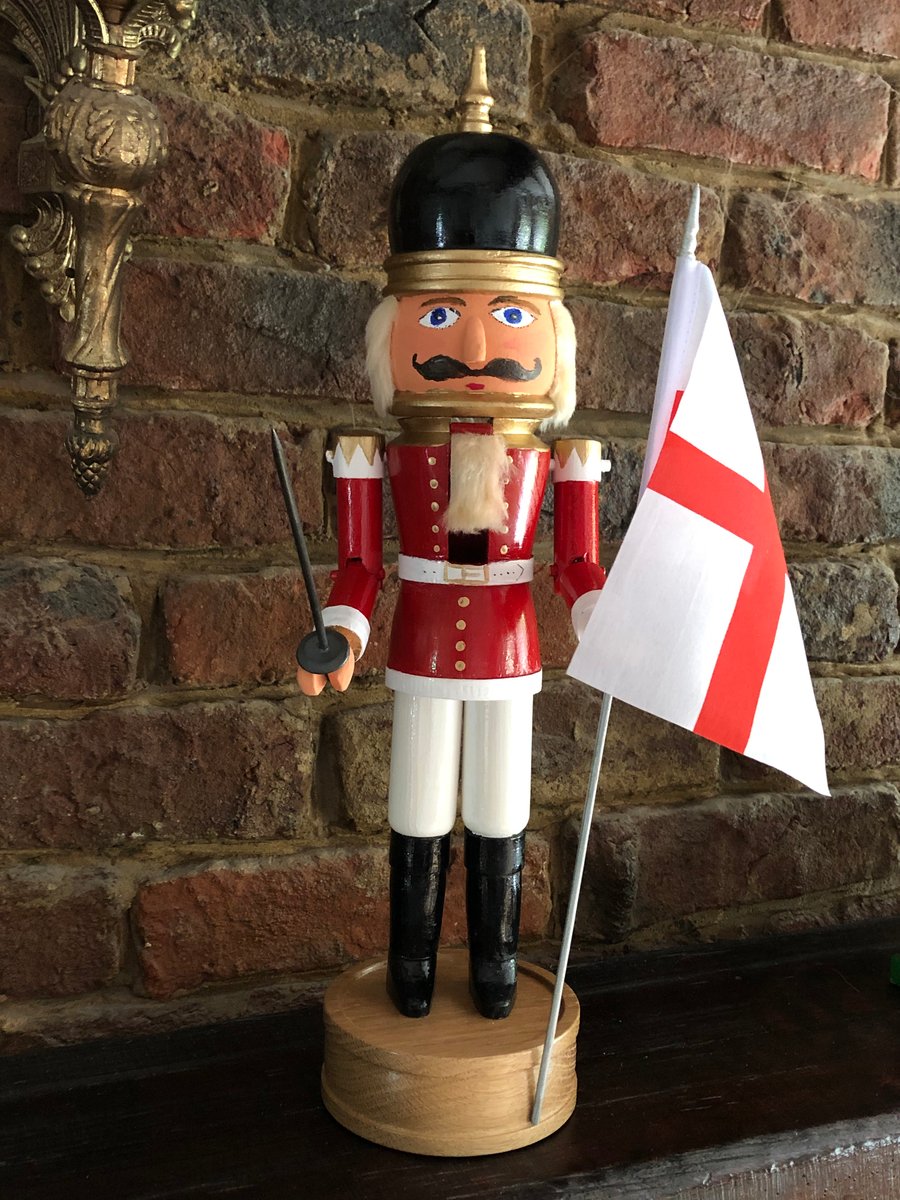 Nutcracker soldier on a  turned oak base, English flag and sword