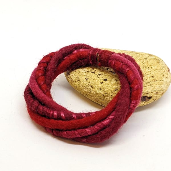 Felted merino cord bracelet in shades of red