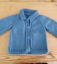 Baby cardigan handmade in denim blue merino wool to fit 3-6 months.