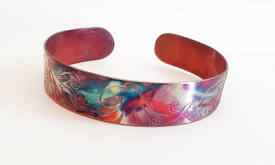 copper octopus cuff with heat coloured finish