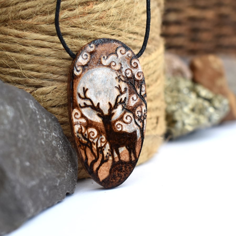 Stag in the moonlight. Pyrography wooden oval pendant. 