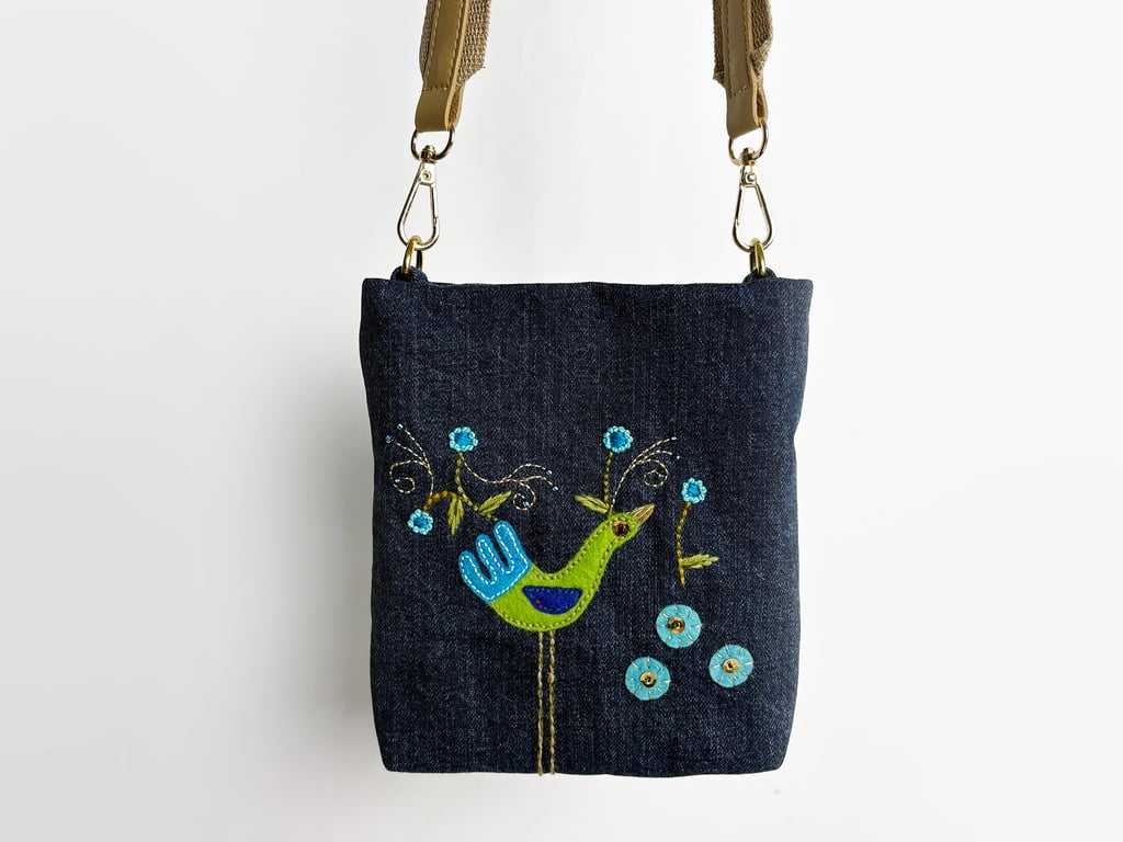 Small crossbody bag in blue denim with hand appliquéd peacock