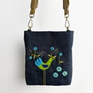 Small crossbody bag in blue denim with hand appliquéd peacock