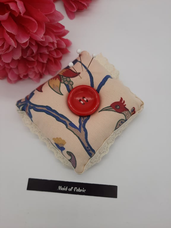 Pin cushion in cream floral and bird fabric with lace