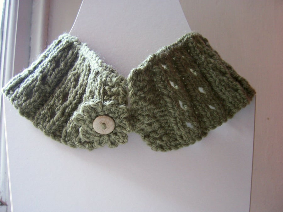 Hand knit eyelet button fastening neckwarmer scarf in soft green