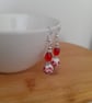 RED, WHITE AND SILVER CERAMIC BEAD EARRINGS. - Image 2