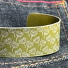 Geometric seed head print cuff bracelet olive