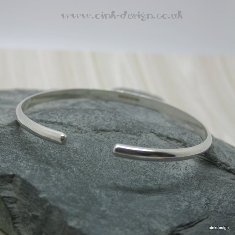 Small sterling silver D wire open bangle