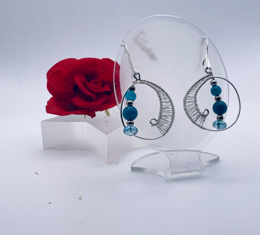 Delightful figure of eight silver plate wired blue gemstone hoop earrings