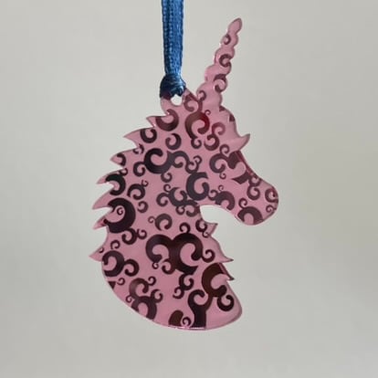 Pink mirrored acrylic unicorn decoration