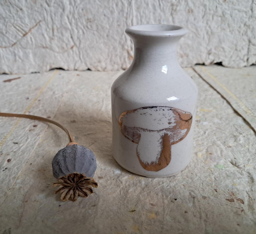 Stoneware bud vase with a copper toadstool image
