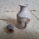 Stoneware bud vase with a copper toadstool image