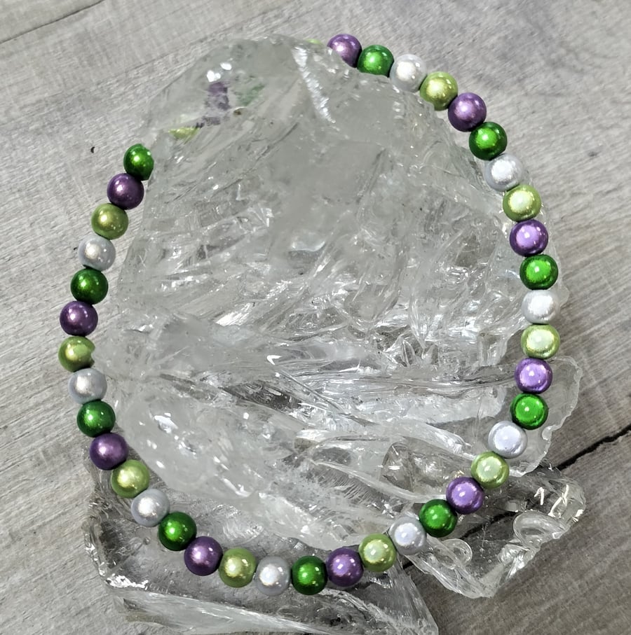 AL145A  Purple, greens and silver miracle bead elasticated anklet 