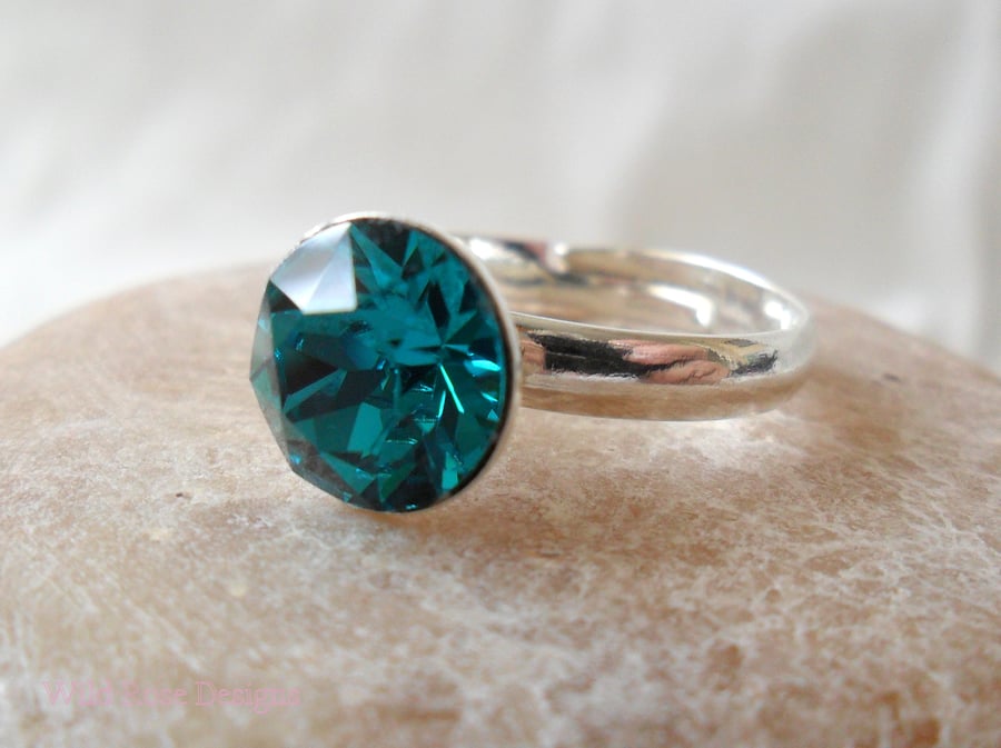 Adjustable ring with a blue crystal