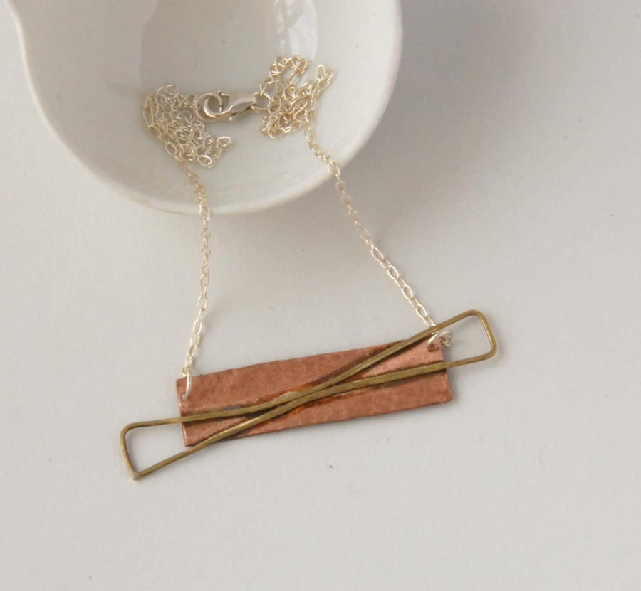 Copper, brass and silver abstract bow necklace