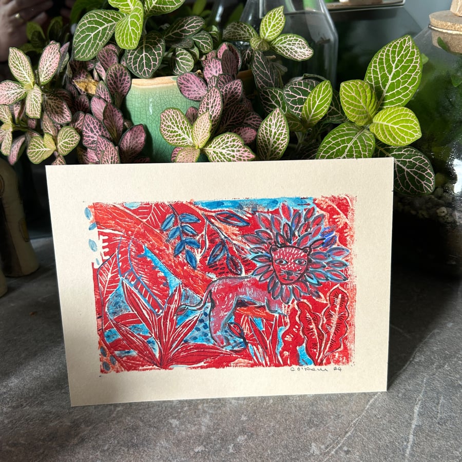 Lounging Lion in red and blue - original artwork by Catherine O'Neill