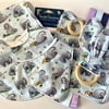 Five piece baby set - two bibs, shaped burp cloth, tag toy & teether - Eeyore
