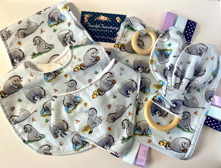 Five piece baby set - two bibs, shaped burp cloth, tag toy & teether - Eeyore